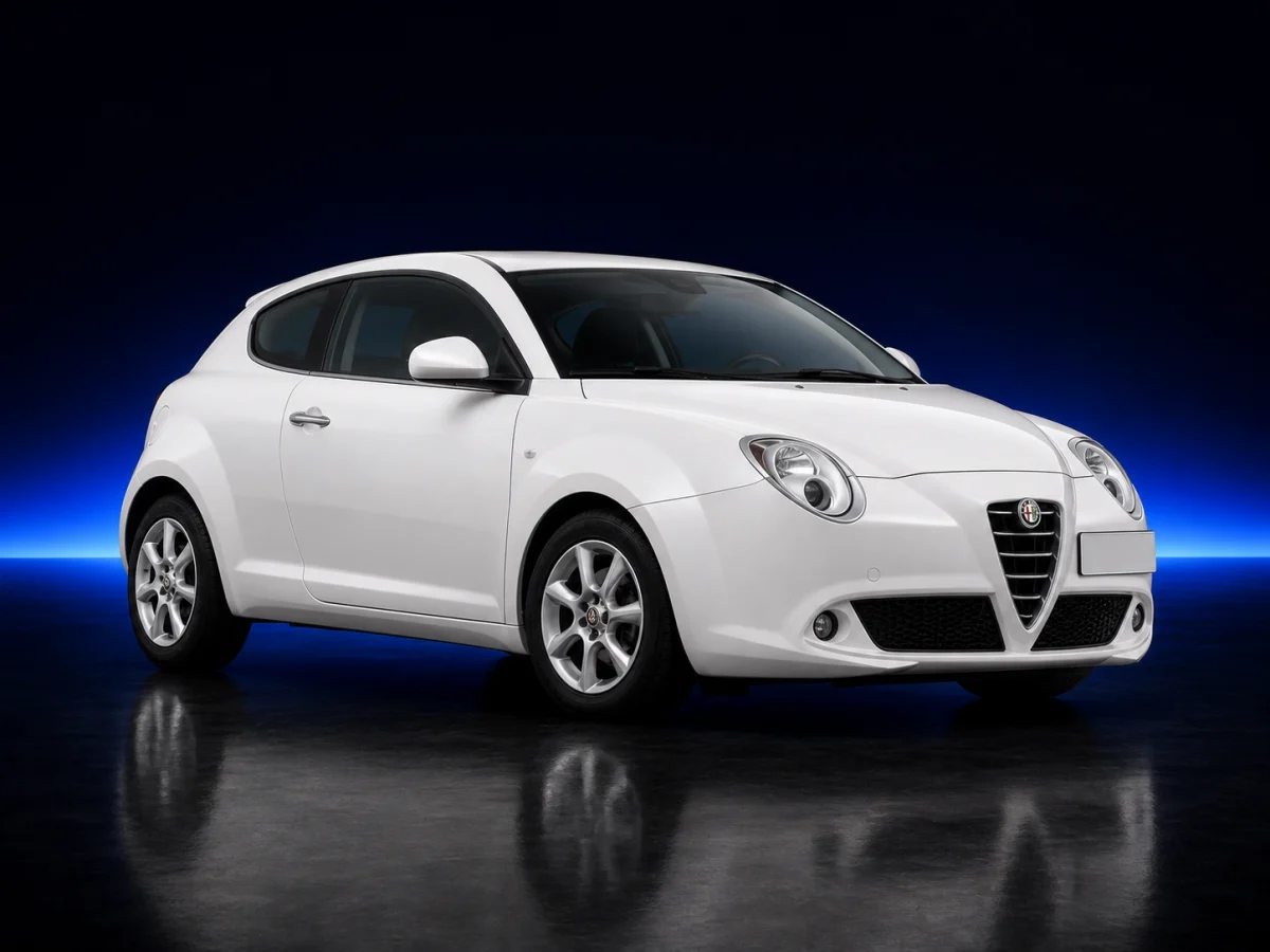 White Alfa Romeo MiTo 955 hatchback on a deep navy and cobalt studio background.
