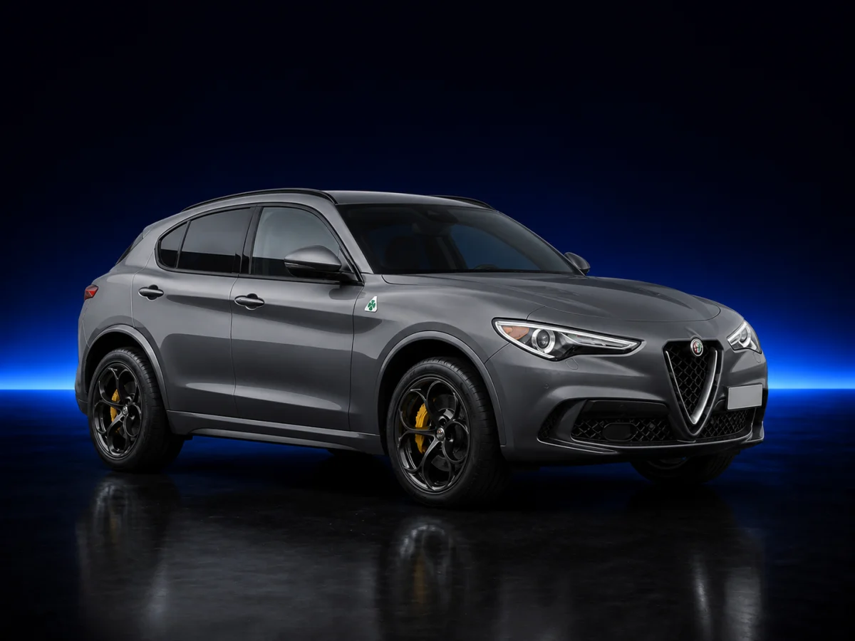 Grey Alfa Romeo Stelvio 949 on a deep navy and cobalt studio background.