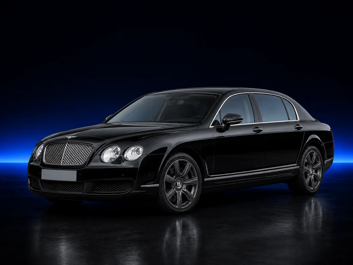 Black Bentley Continental Flying Spur on a deep navy and cobalt studio background.