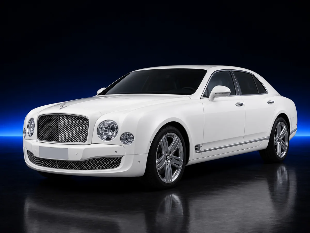White Bentley Mulsanne on a deep navy and cobalt studio background.
