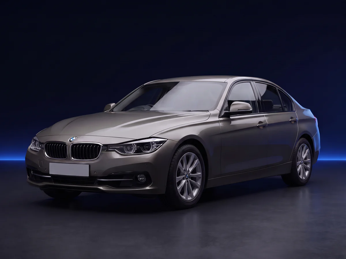 Grey BMW 3 Series F30 LCI 320i saloon on a deep navy and cobalt studio background.