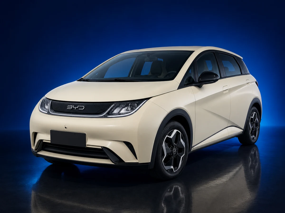 Cream-white first-generation BYD Dolphin electric hatchback on a deep navy and cobalt studio background.