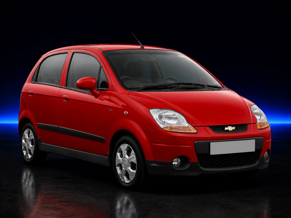 Red Chevrolet Matiz II M250 SE five-door hatchback on a deep navy and cobalt studio background.