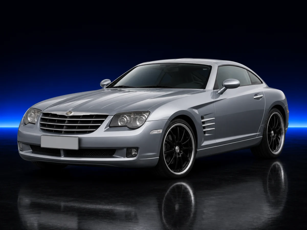 Silver Chrysler Crossfire I ZH32 coupé on a deep navy and cobalt studio background.
