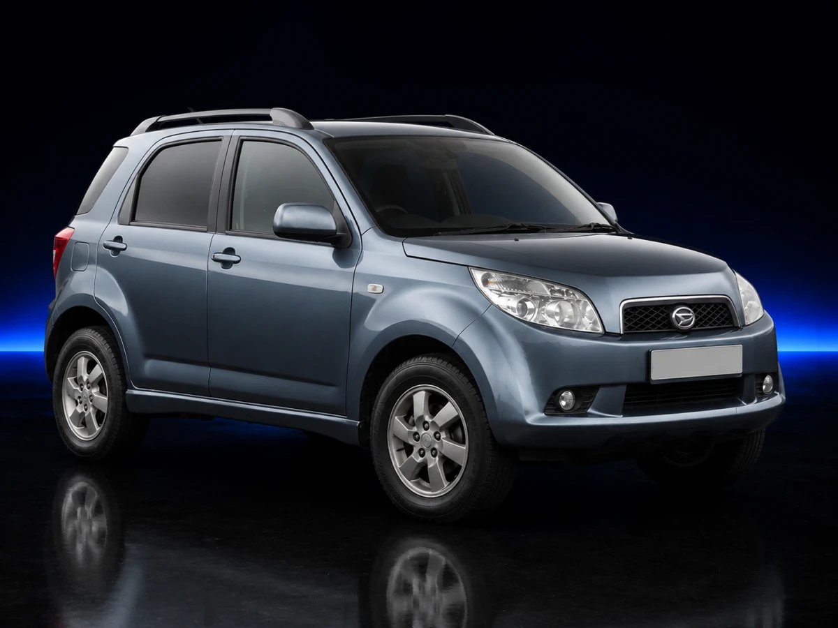 Blue-grey Daihatsu Terios II J200 SE SUV on a deep navy and cobalt studio background.