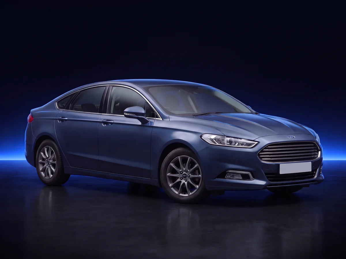 Blue Ford Mondeo Mk5 Titanium Edition on a deep navy and cobalt studio background.