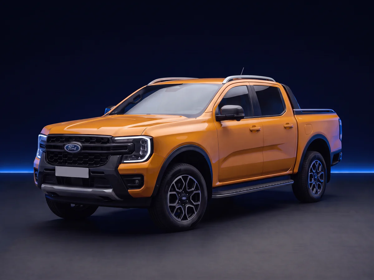 Orange Ford Ranger T6 P703 Wildtrak on a deep navy and cobalt studio background.