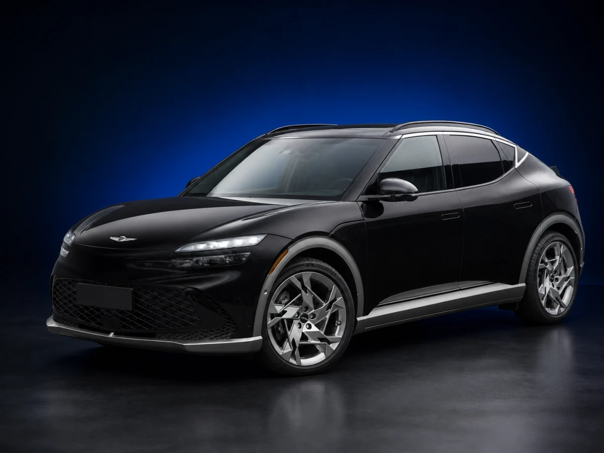 Vik Black Genesis GV60 JW Performance electric crossover on a deep navy and cobalt studio background.