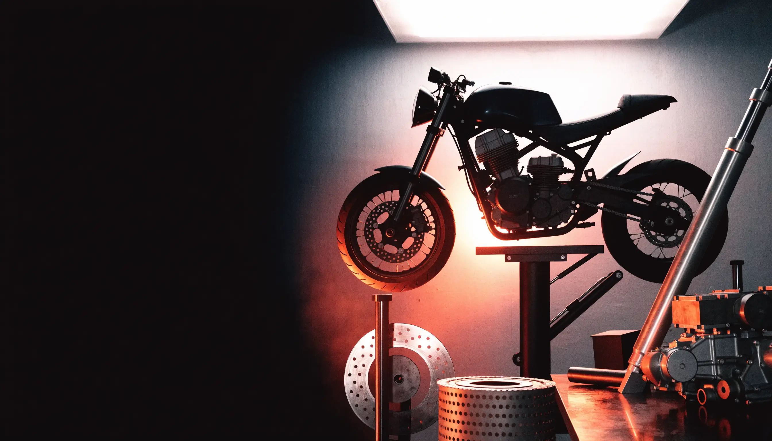 Unbranded motorcycle and components in a specialist workshop
