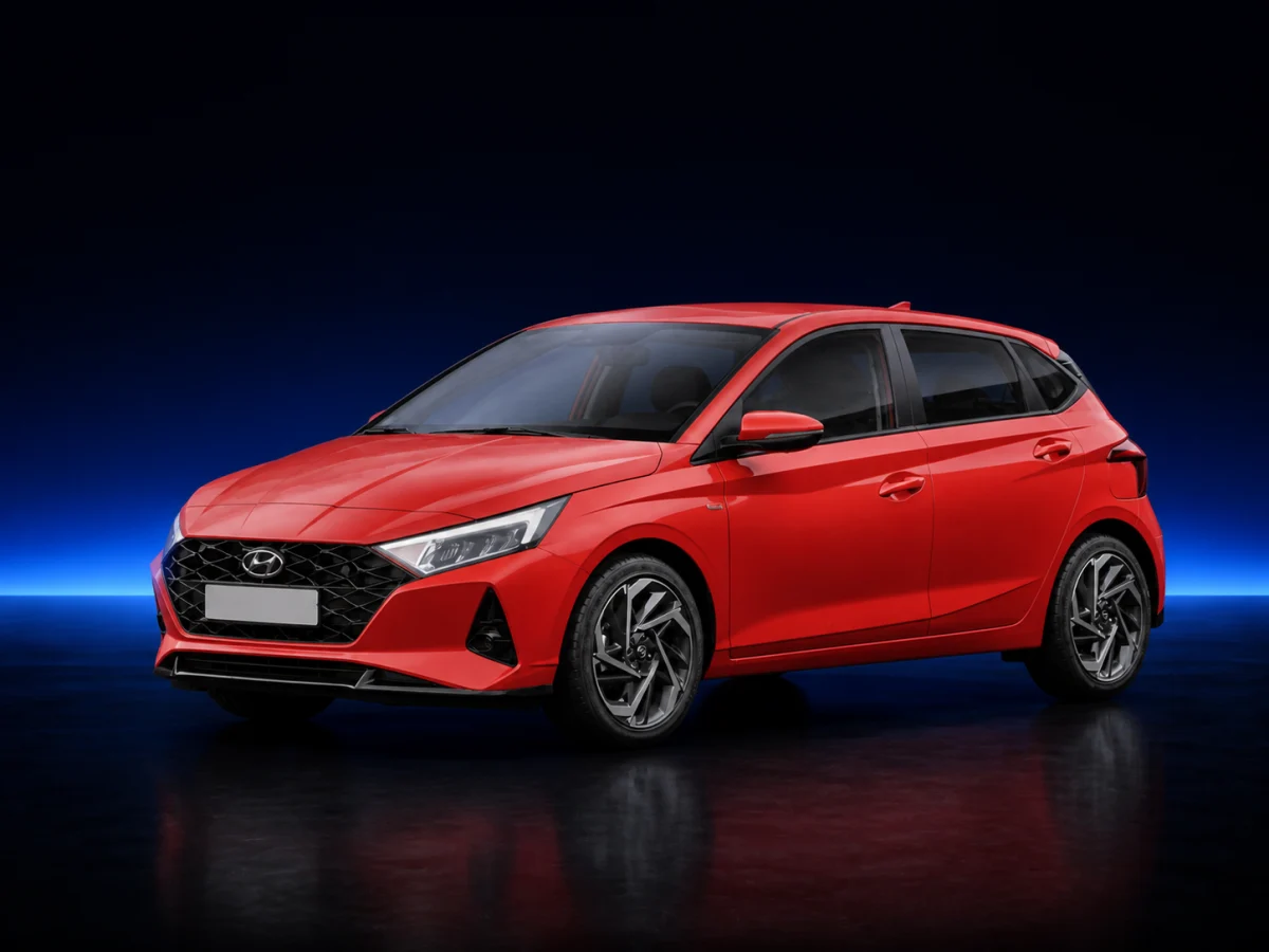Red Hyundai i20 III on a deep navy and cobalt studio background.