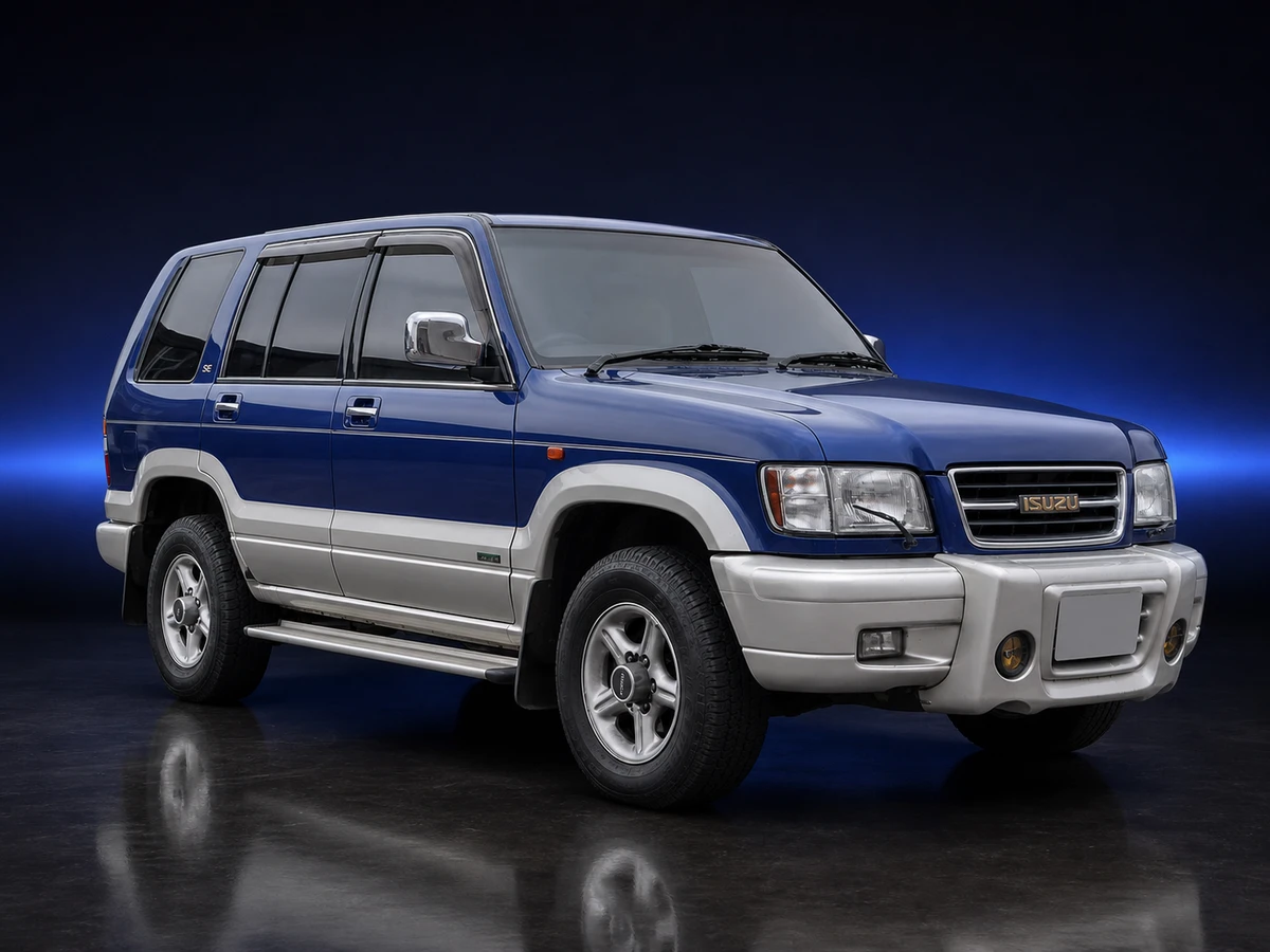 Blue second-generation Isuzu Bighorn LWB JDM SUV on a deep navy and cobalt studio background.