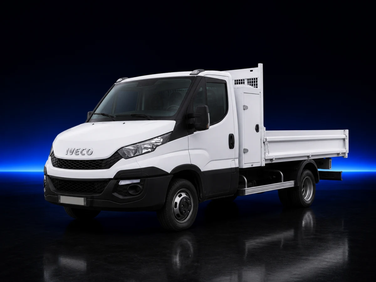 White Iveco Daily VI chassis-cab tipper on a deep navy and cobalt studio background.