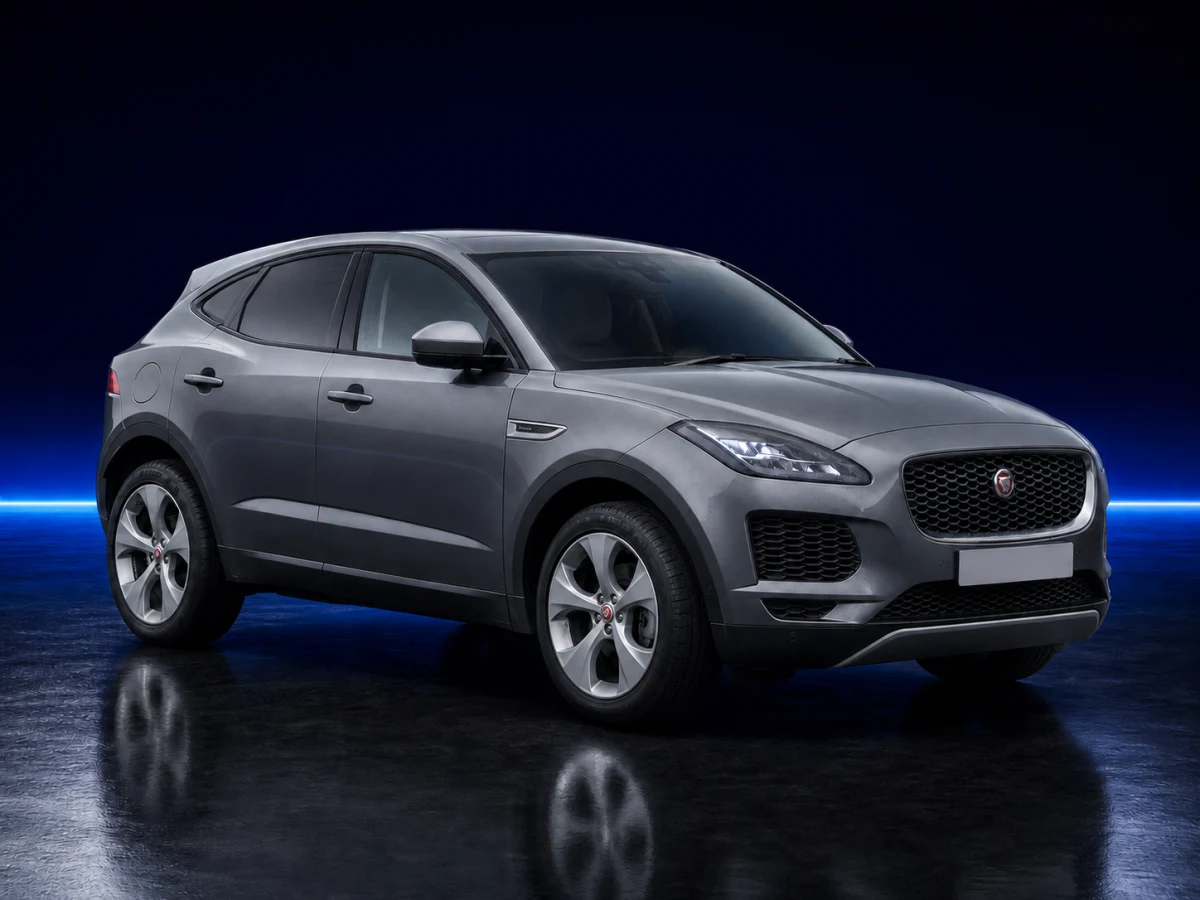 Grey Jaguar E-Pace X540 on a deep navy and cobalt studio background.