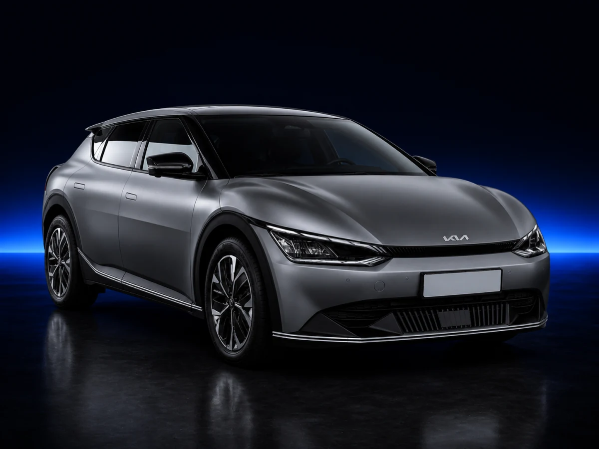 Grey Kia EV6 on a deep navy and cobalt studio background.