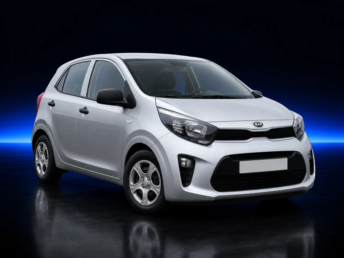Silver Kia Picanto JA on a deep navy and cobalt studio background.