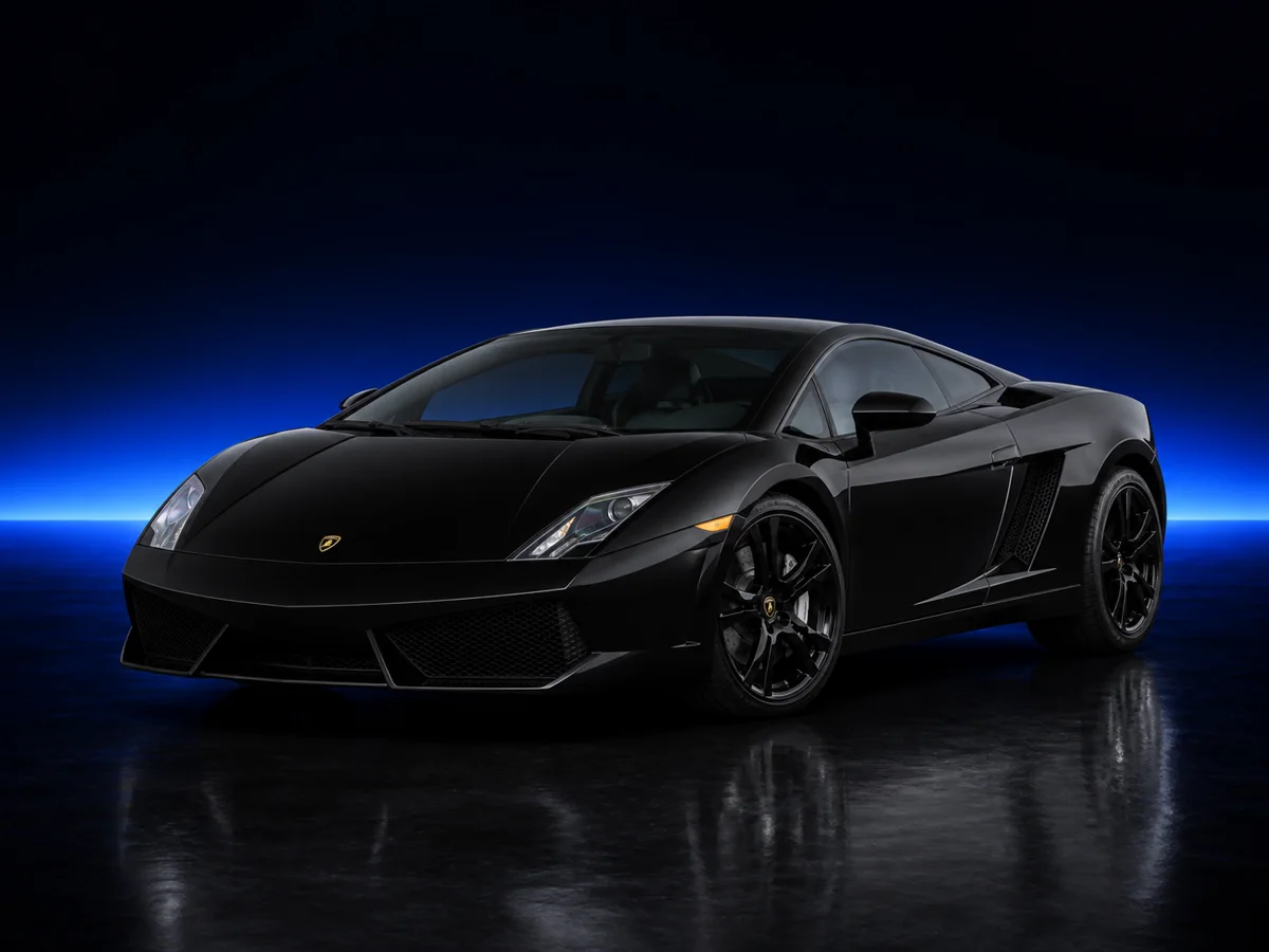 Black Lamborghini Gallardo LP560-4 on a deep navy and cobalt studio background.