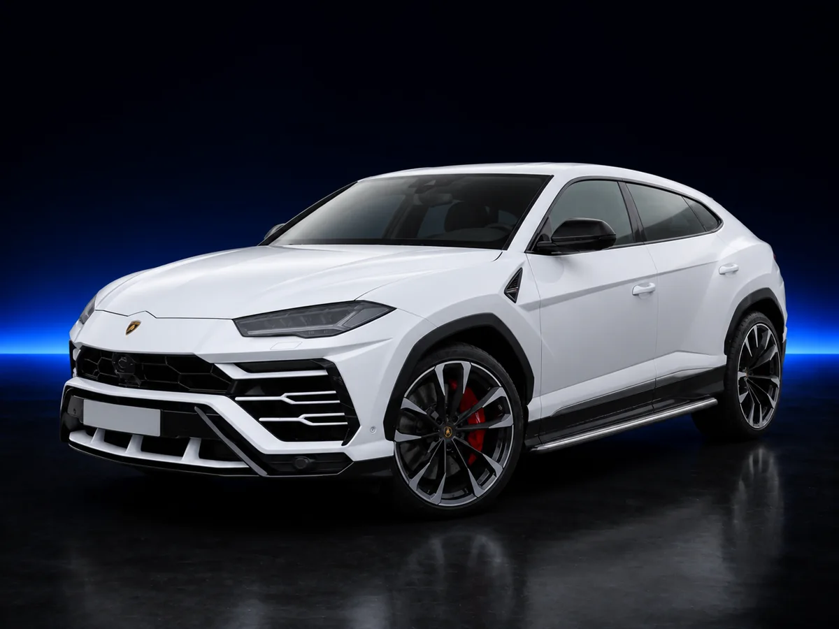 White Lamborghini Urus on a deep navy and cobalt studio background.