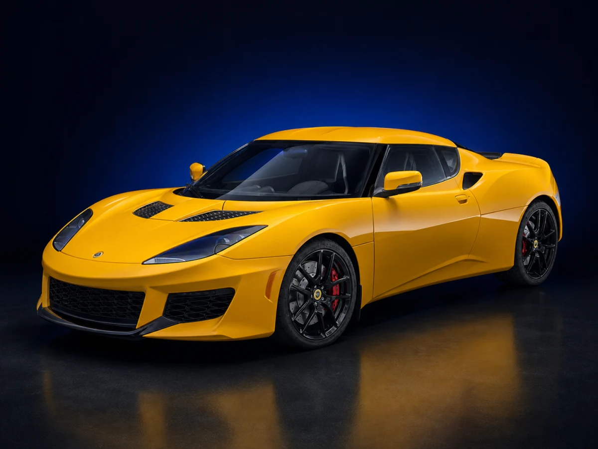 Yellow Lotus Evora 400 coupé on a deep navy and cobalt studio background.
