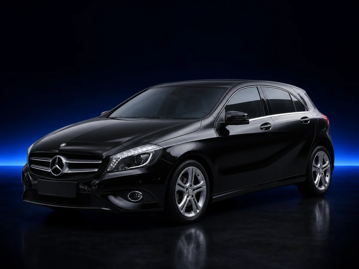 Black Mercedes-Benz A-Class W176 hatchback viewed from the front three-quarter angle.