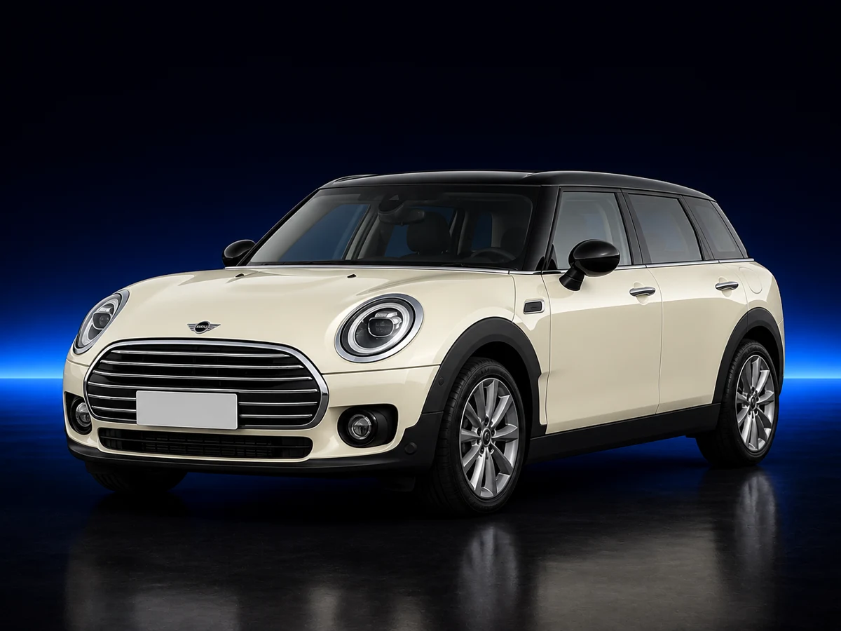 Cream Mini Clubman F54 on a deep navy and cobalt studio background.