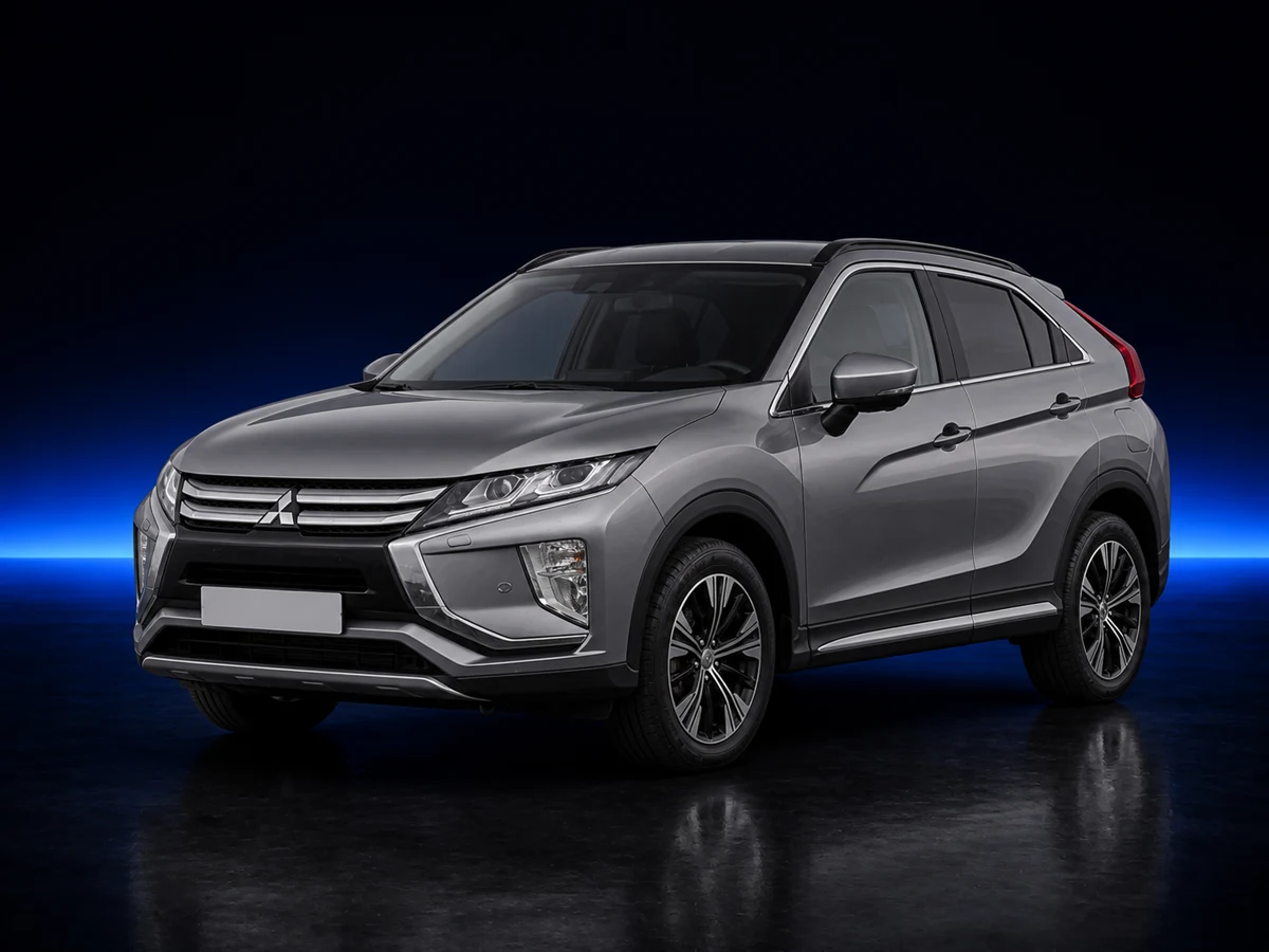 Grey Mitsubishi Eclipse Cross first generation on a deep navy and cobalt studio background.
