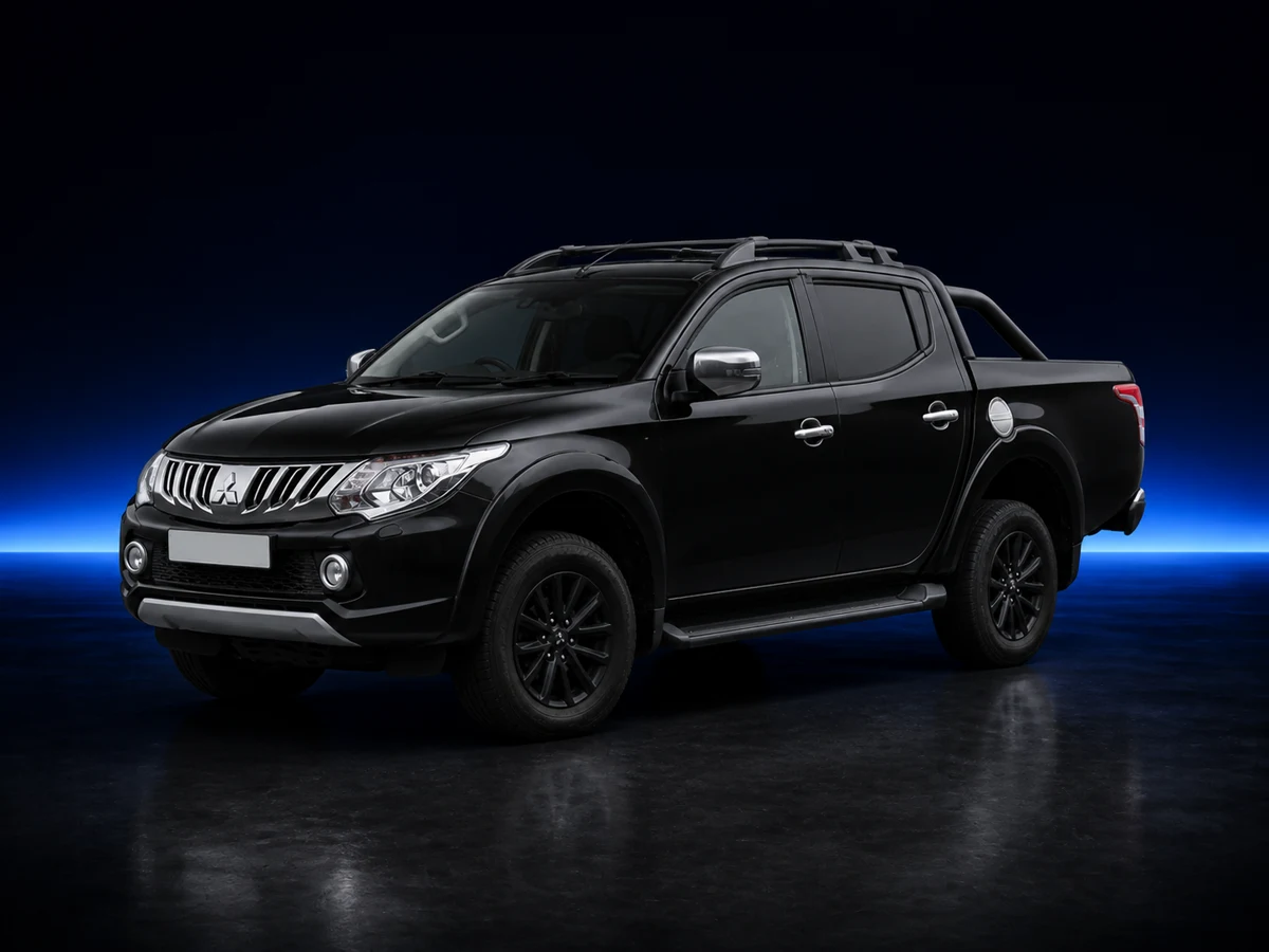Black Mitsubishi L200 fifth-generation double cab on a deep navy and cobalt studio background.
