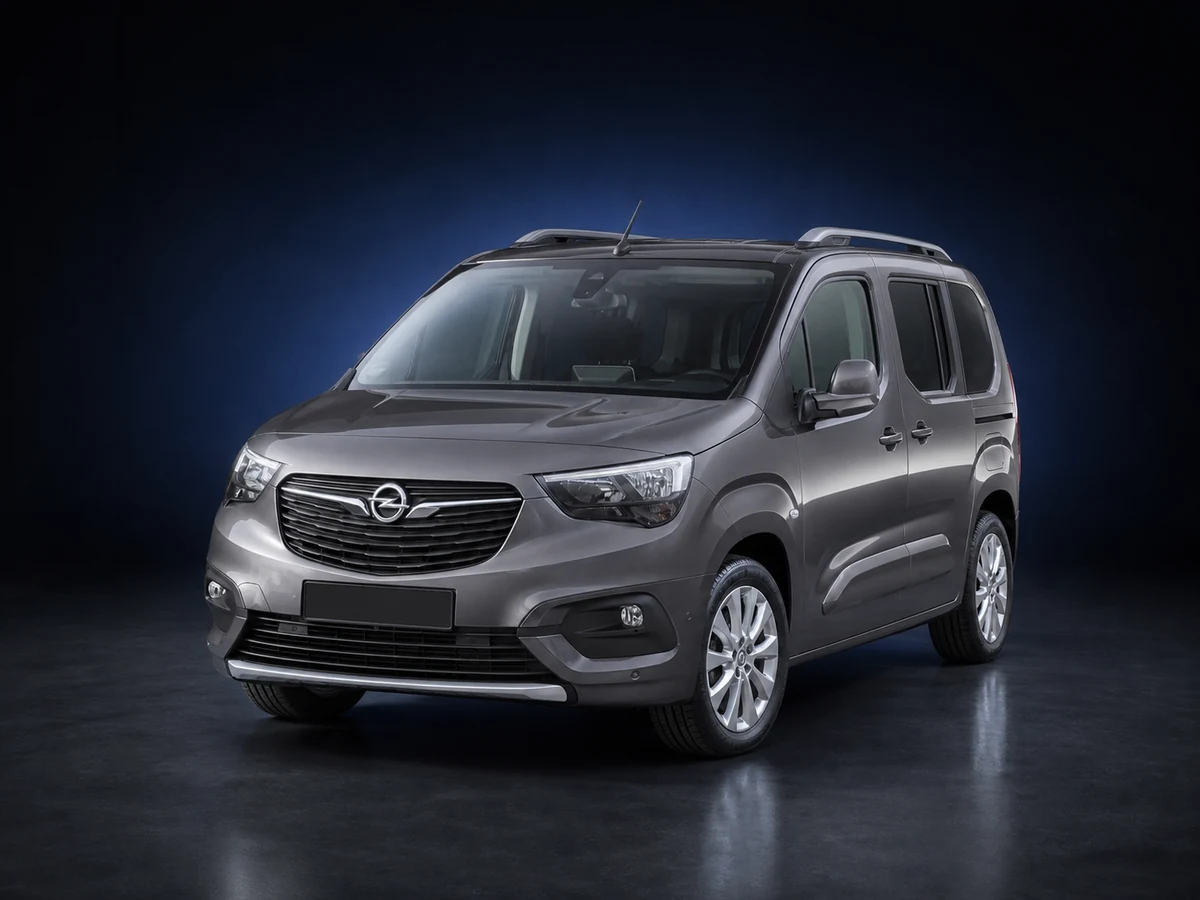 Grey Opel Combo E Life MPV on a deep navy and cobalt studio background.