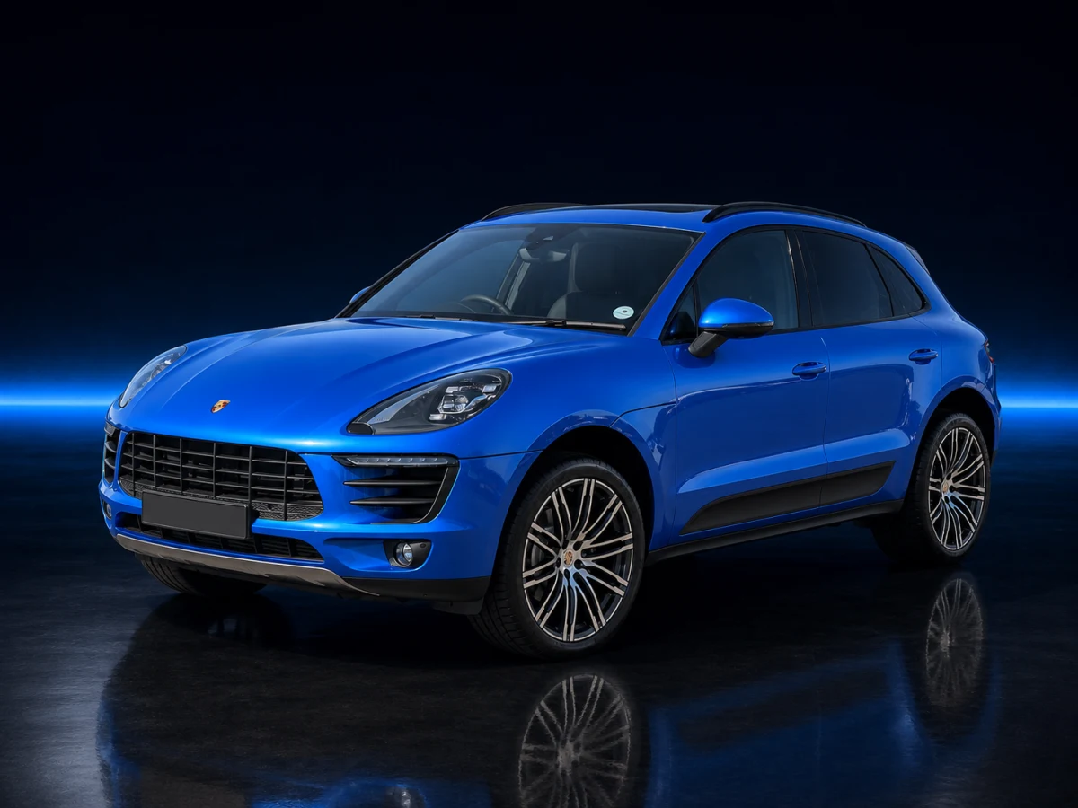 Blue Porsche Macan 95B on a deep navy and cobalt studio background.