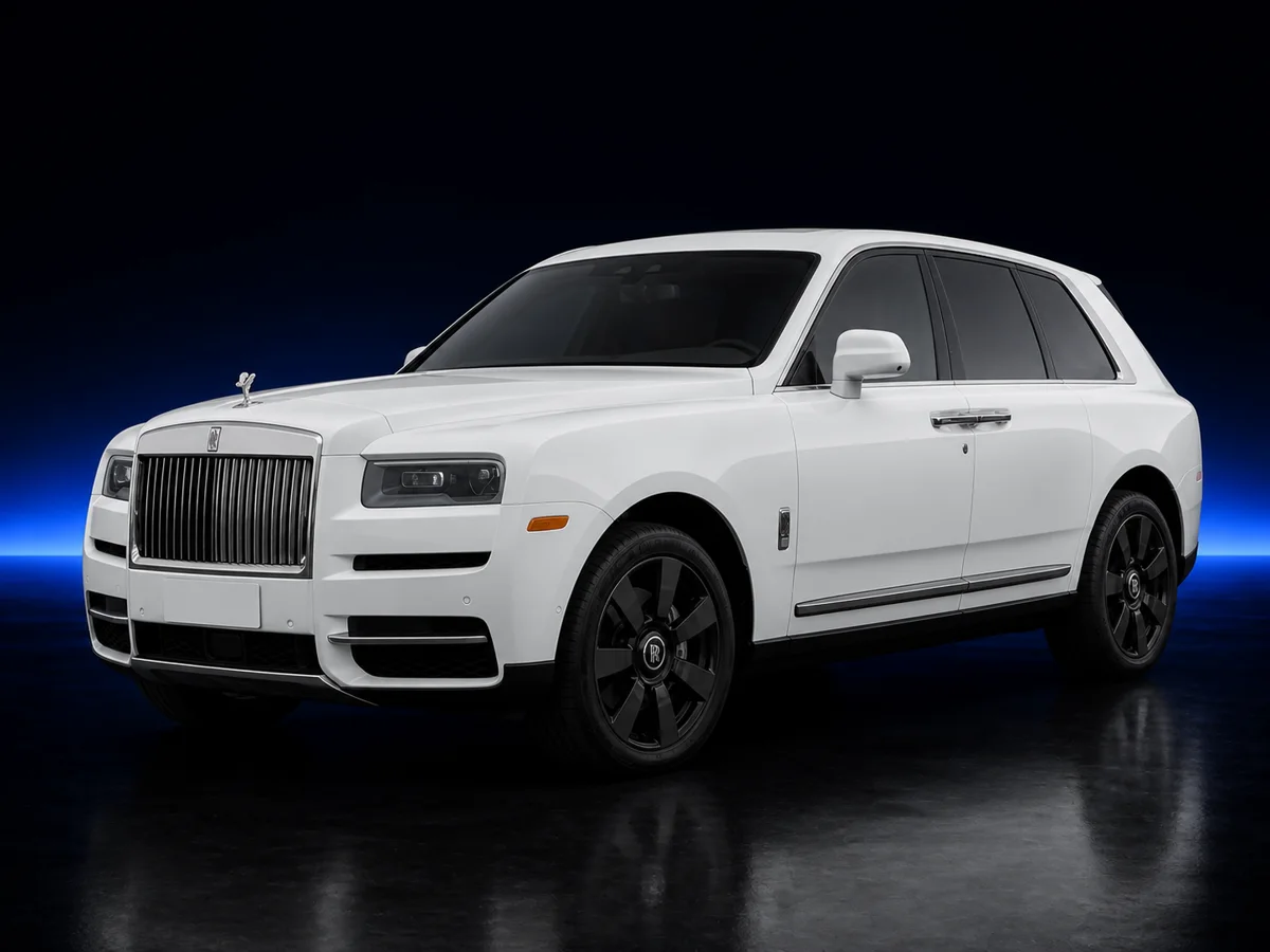 White Rolls-Royce Cullinan on a deep navy and cobalt studio background.