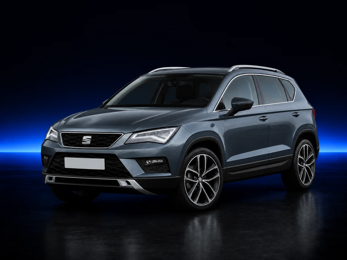 Grey SEAT Ateca on a deep navy and cobalt studio background.