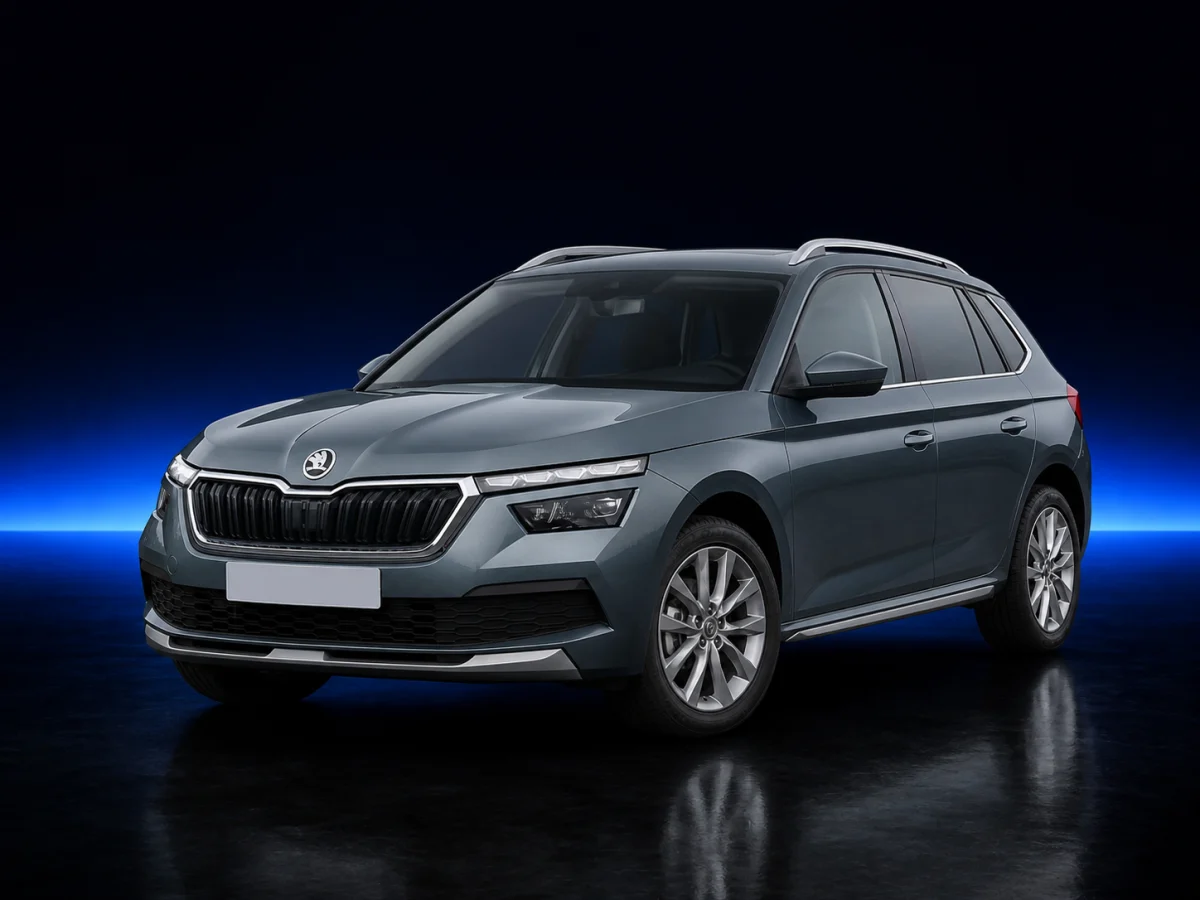 Grey Skoda Kamiq on a deep navy and cobalt studio background.
