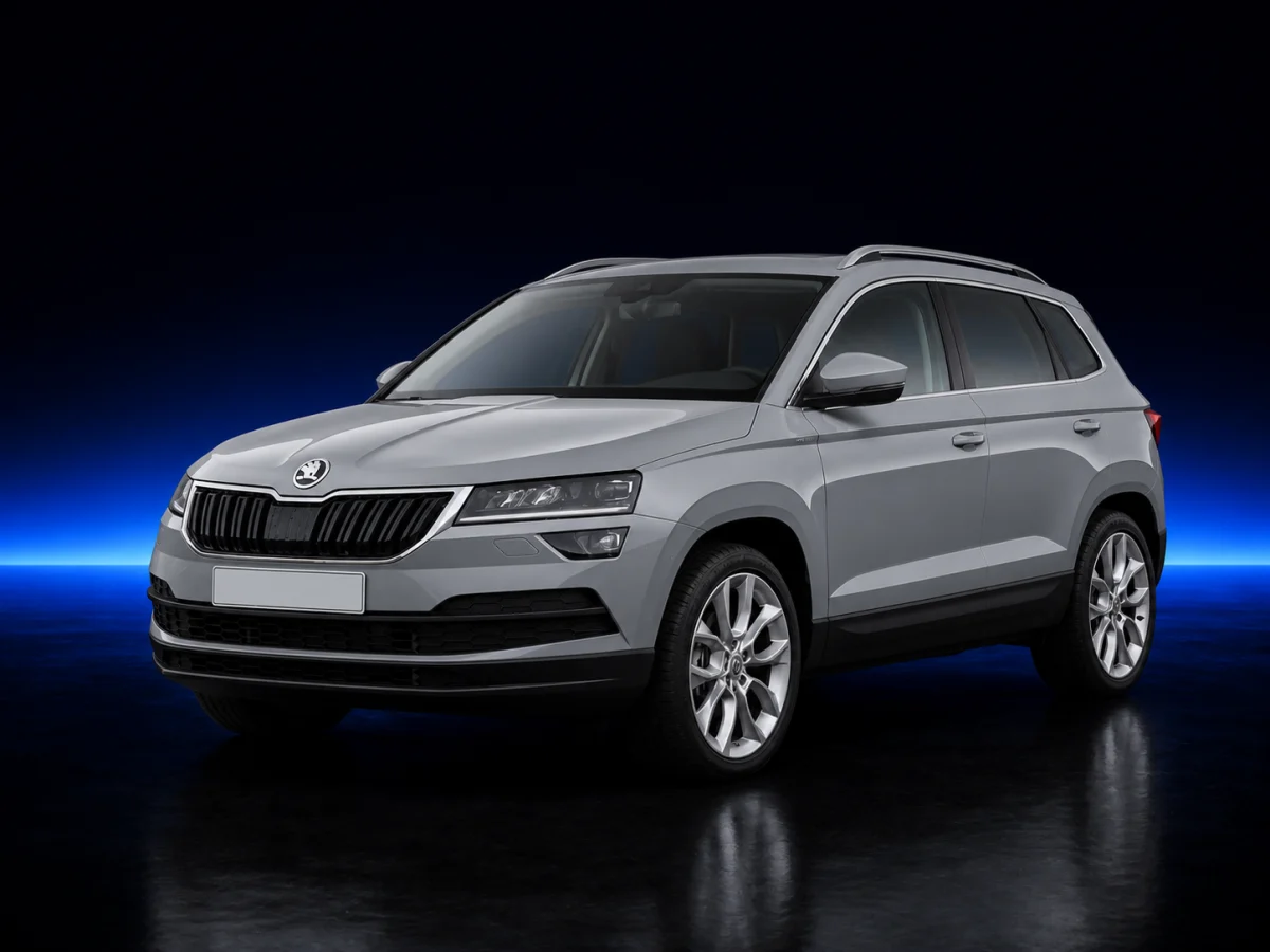 Silver Skoda Karoq on a deep navy and cobalt studio background.