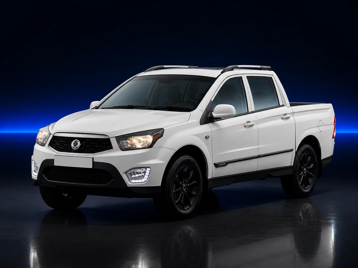 White SsangYong Musso QJ facelift pickup on a deep navy and cobalt studio background.