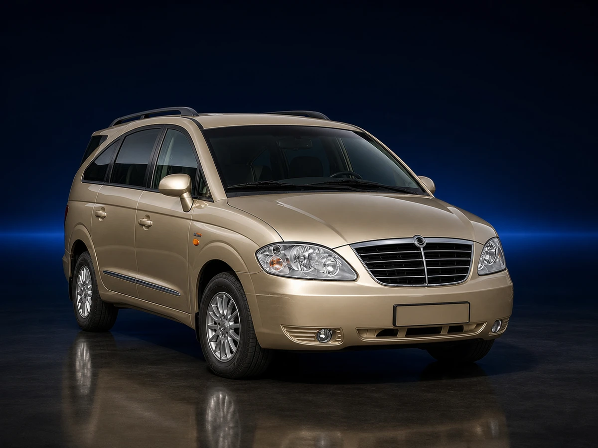 Bronze first-generation facelift SsangYong Rodius MPV on a deep navy and cobalt studio background.