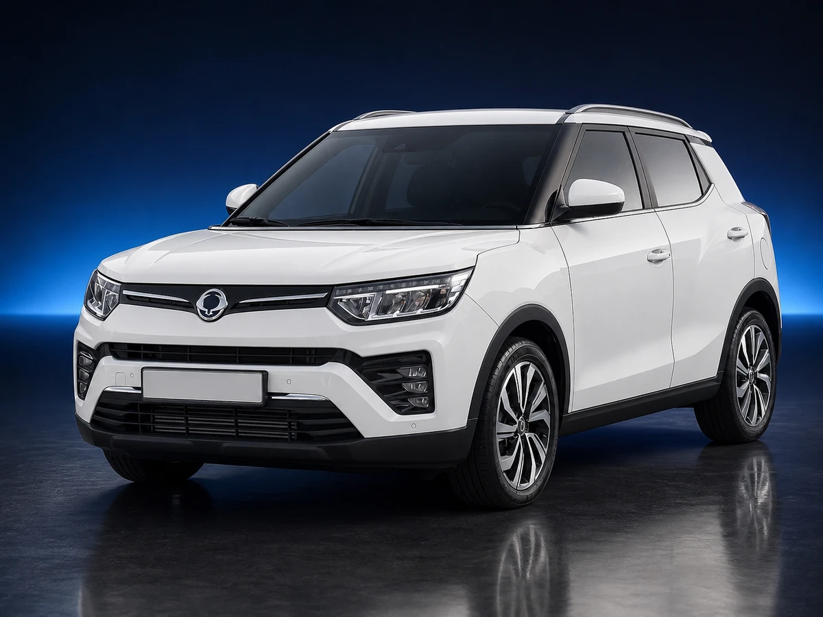 White SsangYong Tivoli X150 facelift SUV on a deep navy and cobalt studio background.