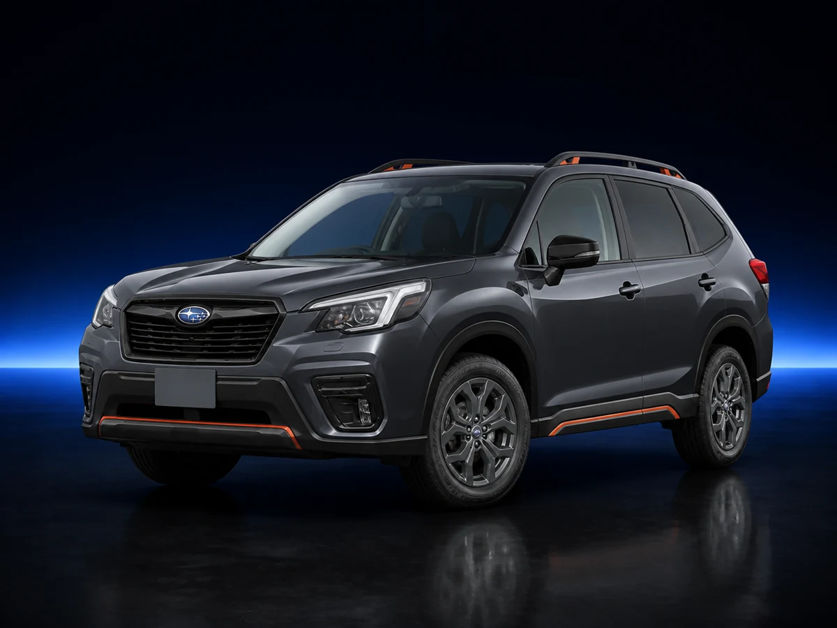 Grey Subaru Forester fifth-generation X-Break on a deep navy and cobalt studio background.