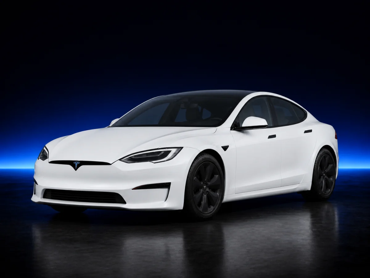 White Tesla Model S Palladium on a deep navy and cobalt studio background.