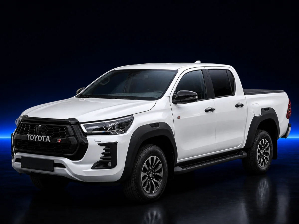 White Toyota Hilux AN120 GR Sport on a deep navy and cobalt studio background.