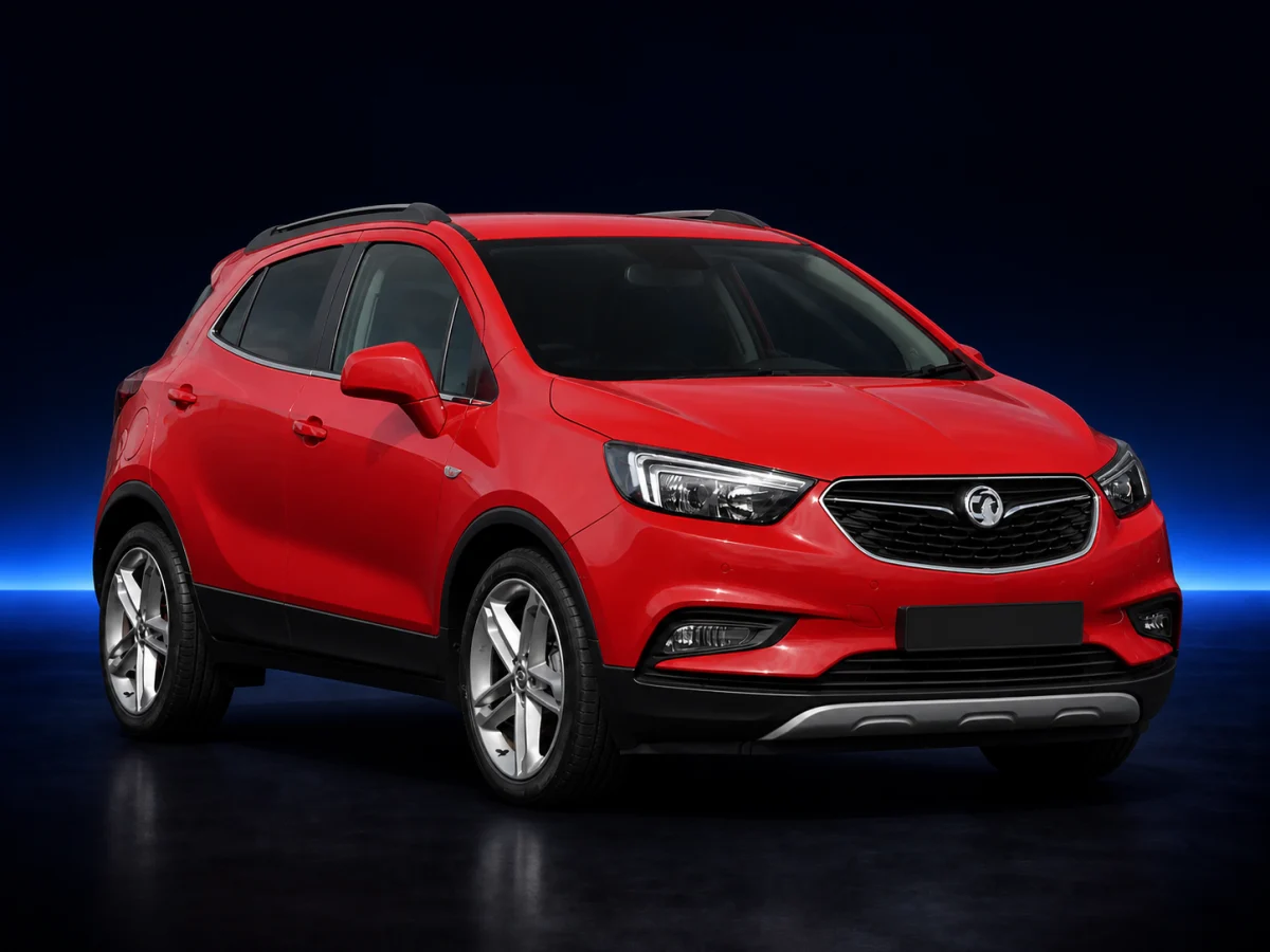 Red Vauxhall Mokka X on a deep navy and cobalt studio background.