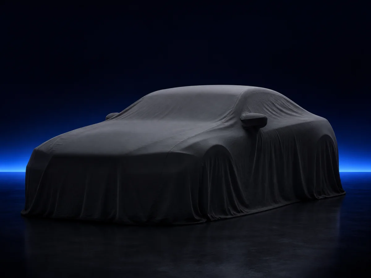 Covered vehicle in a studio; exact model photo is pending review