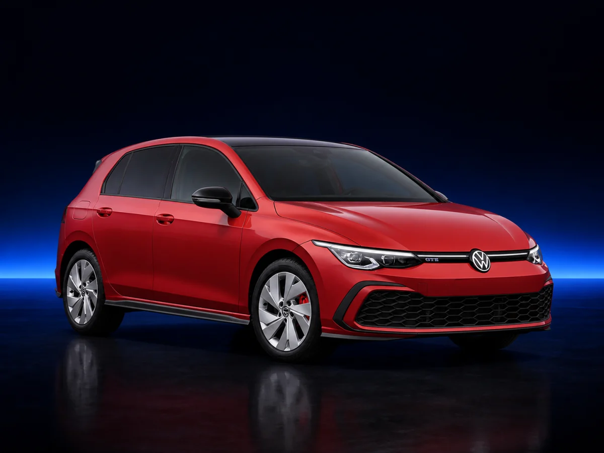 Red Volkswagen Golf VIII GTE on a deep navy and cobalt studio background.