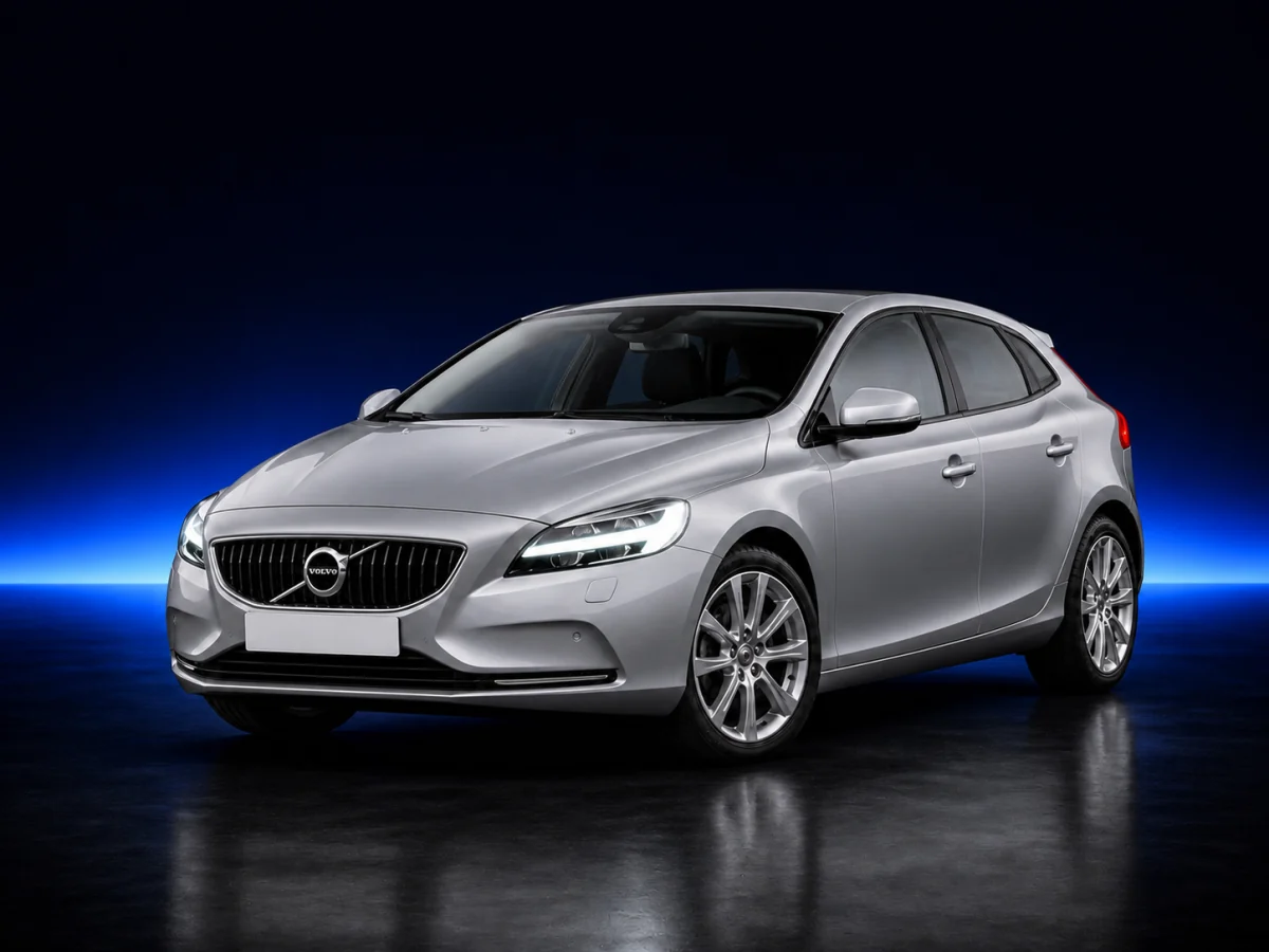 Silver Volvo V40 C1 facelift on a deep navy and cobalt studio background.