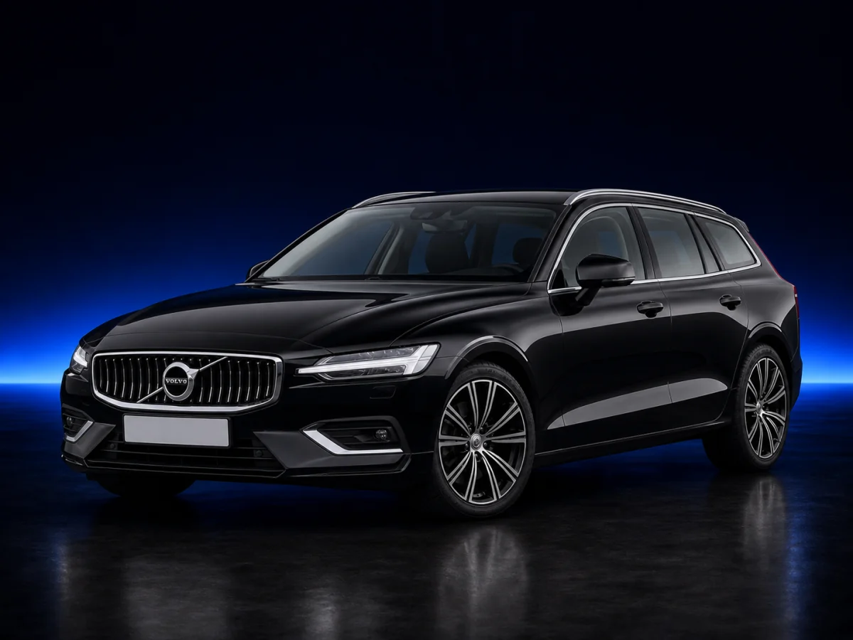 Black Volvo V60 SPA estate on a deep navy and cobalt studio background.