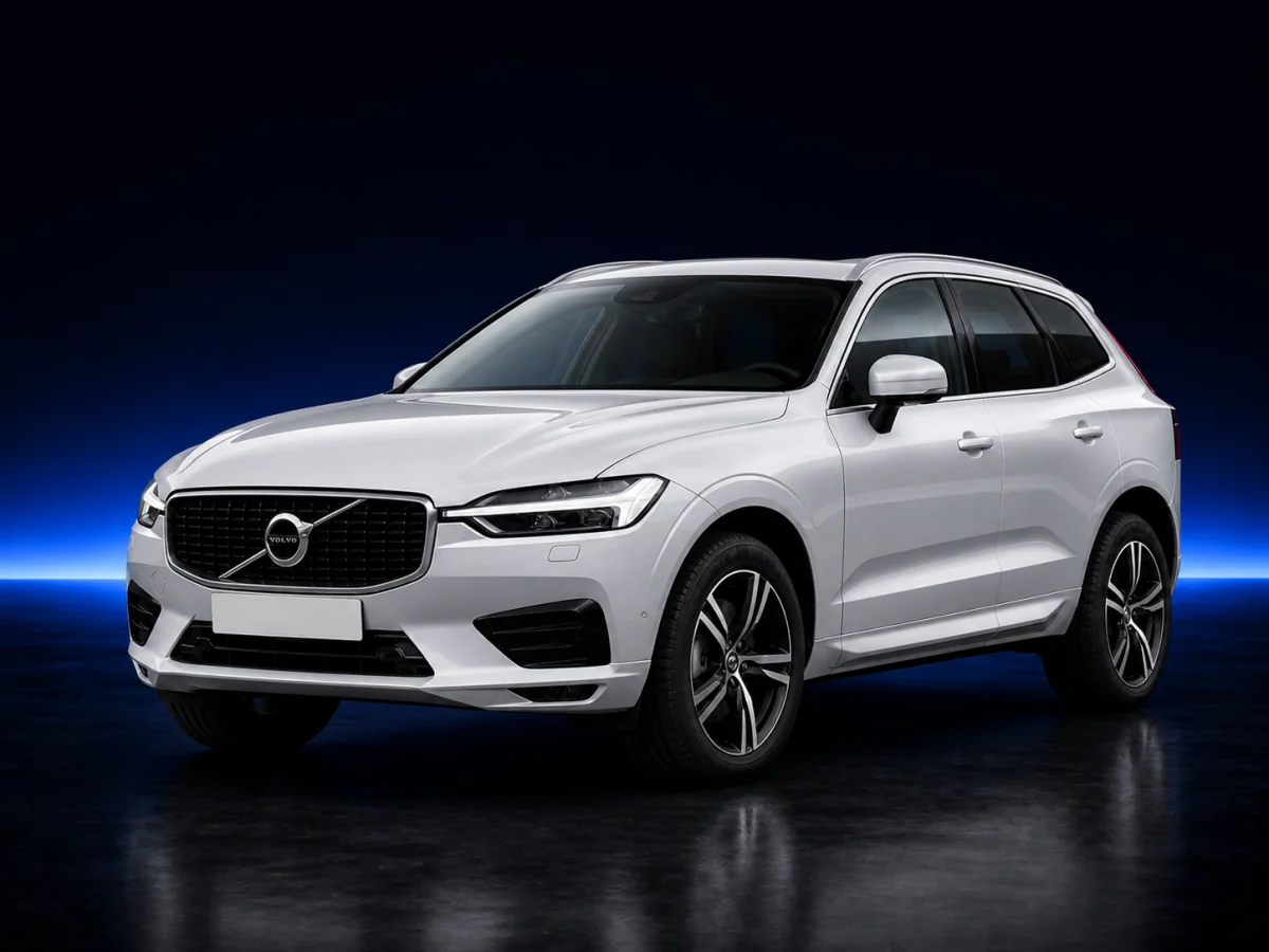 Silver-white Volvo XC60 SPA on a deep navy and cobalt studio background.